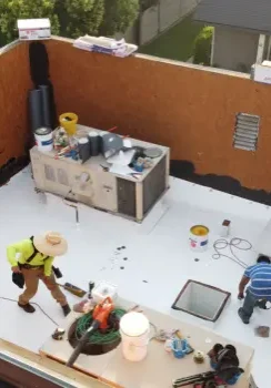 industrial flat roof maintenance team on site
